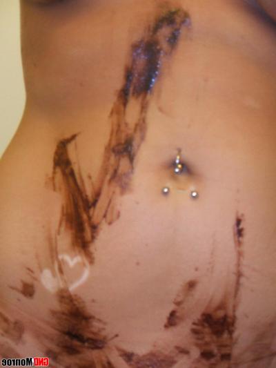 12P Blonde girl with striking eyes covers her naked body in chocolate sauce