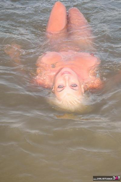 16P Older blonde Dimonty gets completely naked while taking a swim in the ocean