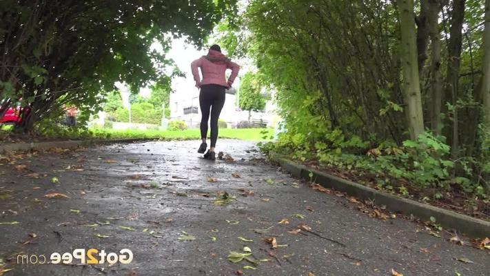 15P Pretty brunette Isabel Dark pulls down her pants to pee on a paved path