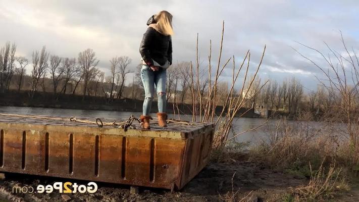 15P Blonde girl Debora squats to take a piss down by a river