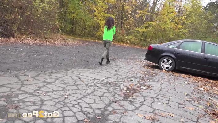 15P Ali Bordeaux takes a piss on a gravel path while wearing black boots