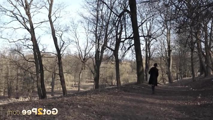15P Caucasian woman Kristina takes a much-needed pee up against an old tree
