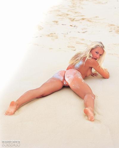 12P Hot middle-aged blonde Jodie Moore licks her lips during a nude shoot