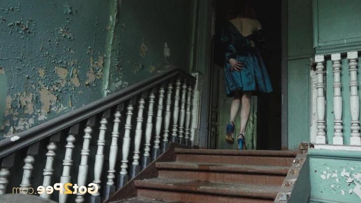 15P Redheaded chick Jeanna lifts up her dress to take a piss on a flight of stairs