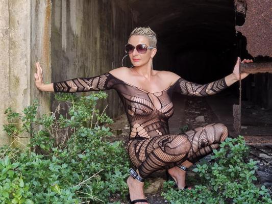 9P Attractive short-haired model flaunts her curves in her see-through lingerie