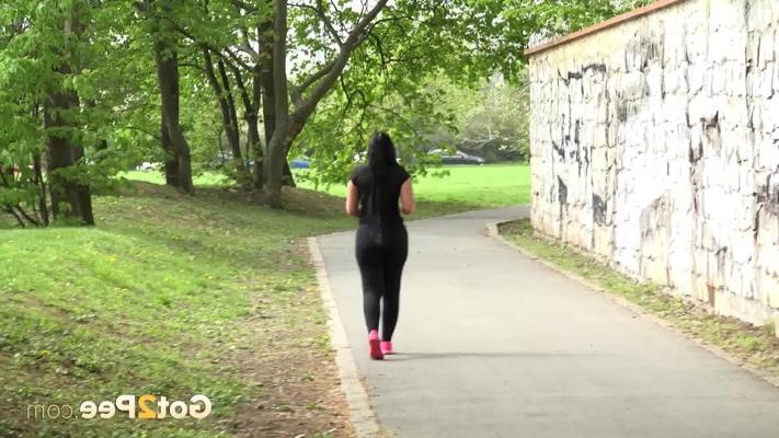 15P Brunette chick Lolita Black pisses on a paved path while out for a walk
