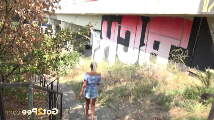 15P Natural blonde Julia Parker takes a piss while descending concrete steps