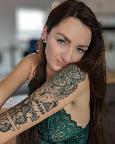 14P Brunette babe with tattoos Lara Lauren poses in lacy lingerie in the morning