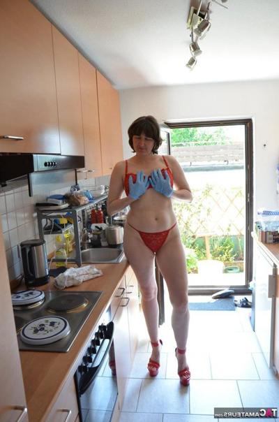 20P Leggy woman does her housework in bra and thong with matching heels