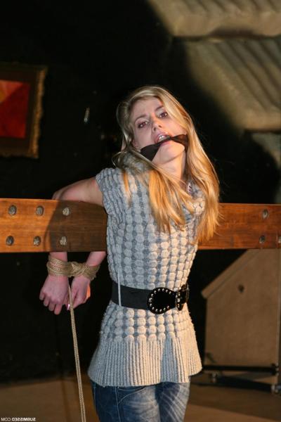 16P Cute blonde girl struggles against gag and ropes with her clothes still on