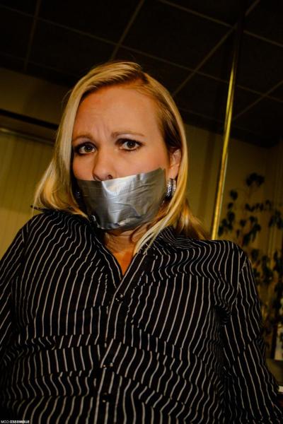 20P Curvy blonde secretary Natalie posing bound to a chair at the office