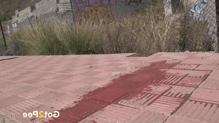15P Blonde girl Aylin Tattoo takes a pee on a sidewalk during the day