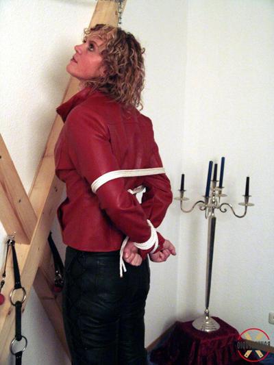 16P Clothed woman Blonde Lea sports curly hair while being tied up & cleave gagged