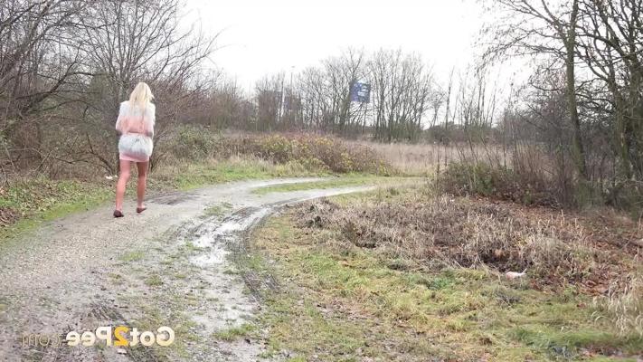 15P Blonde chick Claudia Macc pees in a puddle while walking a gravel path