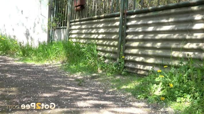 15P Distressed blond Morena squats for an urgent pee outside a fenced yard