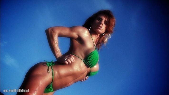 15P Bodybuilder Anna Cervantes displays her hard body outdoors in a green bikini