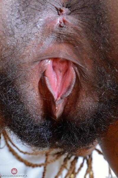 20P Beautiful skinny ebony Kimmy Katt strips and spreads her bushy twat