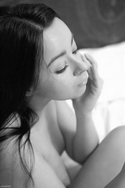 17P Adorable brunette models naked on white sheets with her lovely bush on display