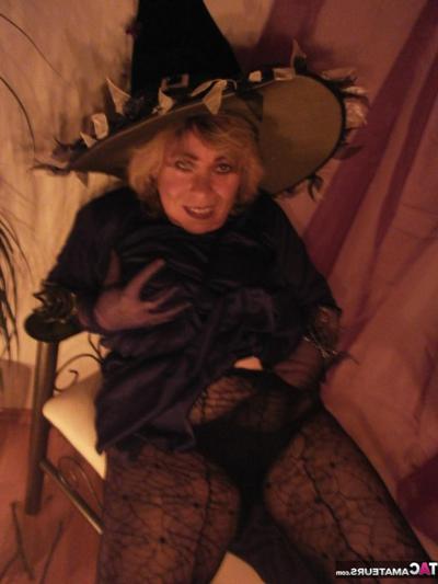 20P Slutty mature witch Caro looks super sexy in her black boots and pantyhose