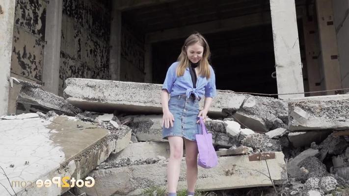 15P Blonde girl Nastya takes an urgent pee at the remains of a concrete building