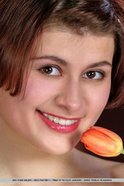 18P Young girl with short hair and a great body Euhenia goes bare naked on a bed