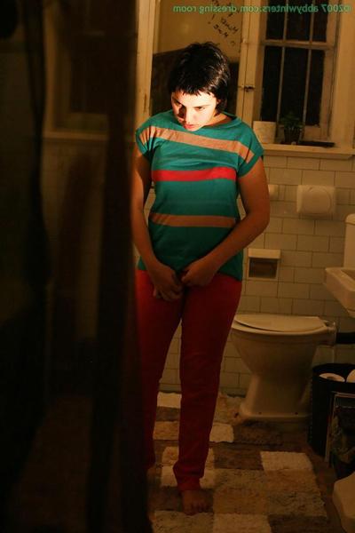 16P Hidden camera films short haired girl getting dressed after taking bath