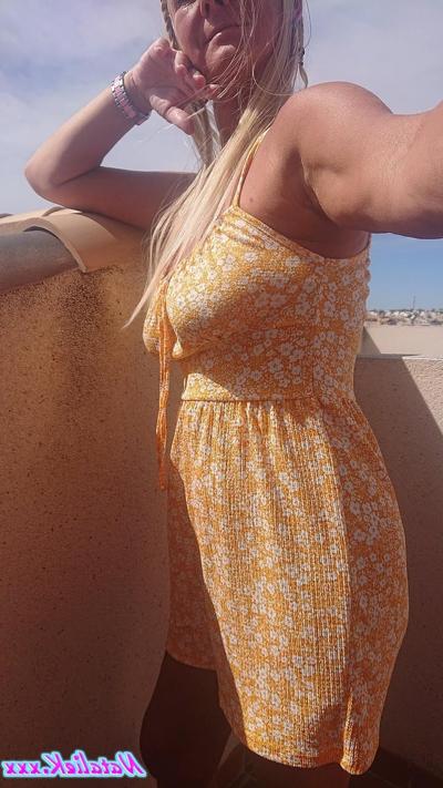 15P Mature Spanish pornstar Natalie K unveiling her big juicy tits on the balcony