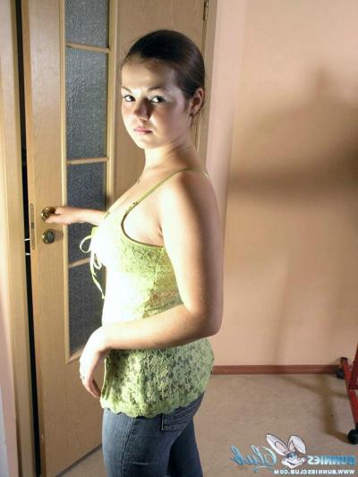 20P Young brunette Bea pulls on a pair of jeans after getting naked to change