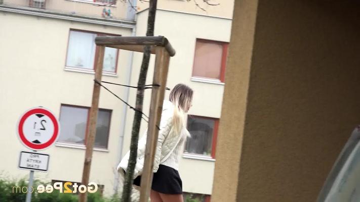 15P Dirty blonde Henriet ducks into a carport before taking a pee on paving stones