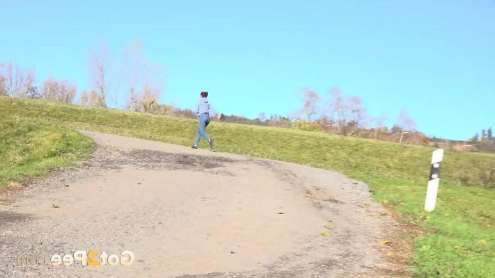 15P White girl Antonia Sainz takes a piss on a gravel road during the day