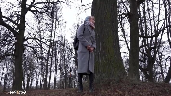15P Blonde girl Masha takes a pee in front of a tree on a chilly day