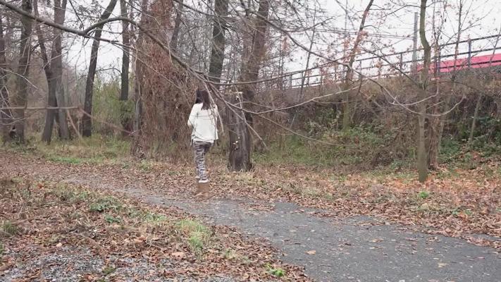 15P Brunette girl Eveline Neill pees on a path while wearing UGGs