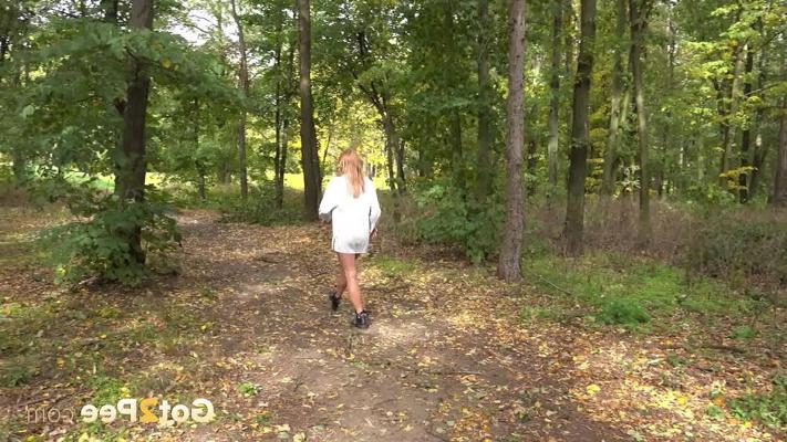 15P Caucasian girl Chrissy Fox takes a piss while sitting on a bench in the woods