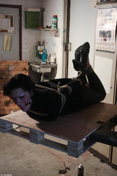 17P Helpless sub Steffi ball gagged & hog tied fully clothed on a shop forklift