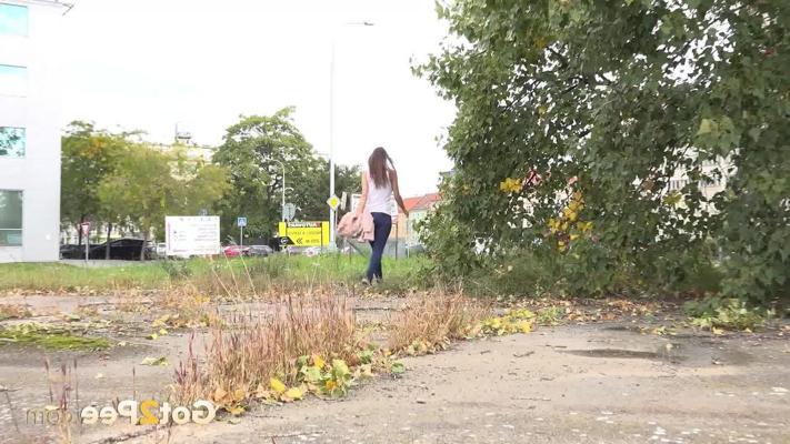 15P Sexy girl Cynthia Vellons ducks behind some trees for a badly needed piss