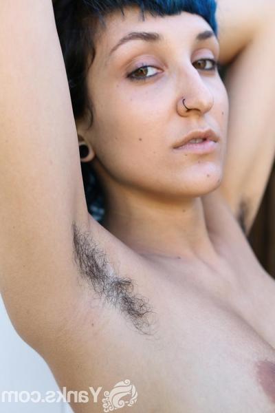 17P Blue haired vixen Jay Elle flaunts her hairy armpits and pussy while stripping