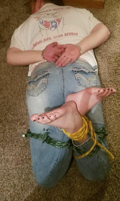 13P Caucasian female with pretty feet finds herself tied up with her clothes on