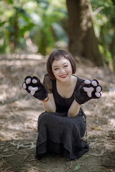 20P Pretty Asian model posing in her elegant black dress in the forest