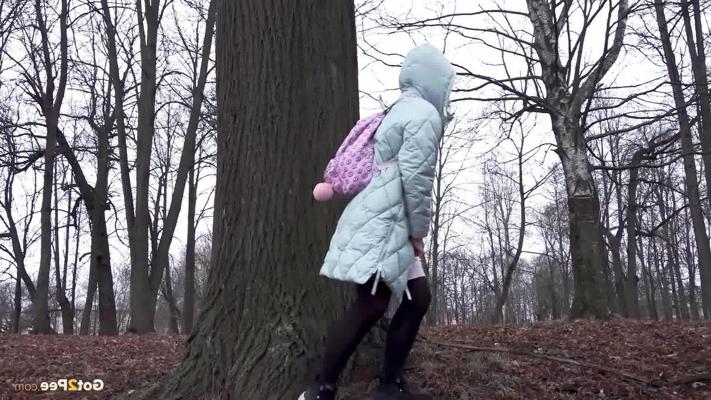 15P Distressed girl Rita pulls down her pantyhose to pee while walking in a forest