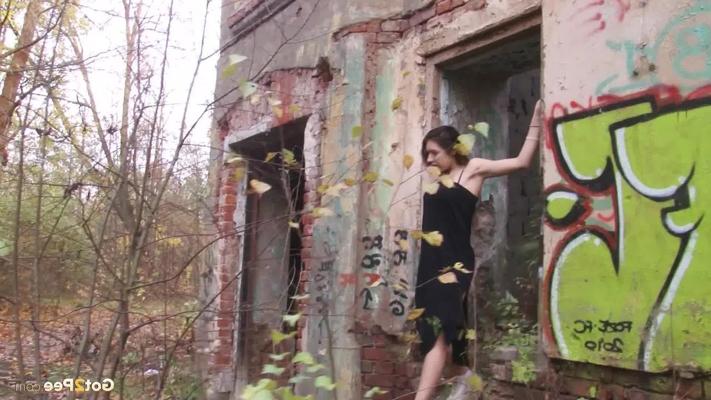 15P Caucasian girl Diana lets loose with a stream of piss at an abandoned building