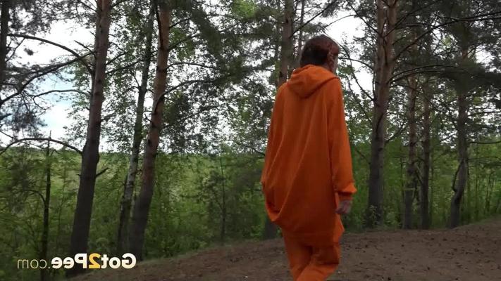 15P Pretty girl Jeanna gets caught taking a piss in the woods up against a tree