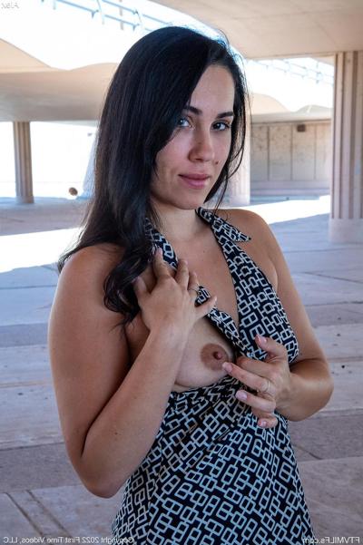 15P Dark haired amateur Alex masturbates with a vibrator on a patio chair